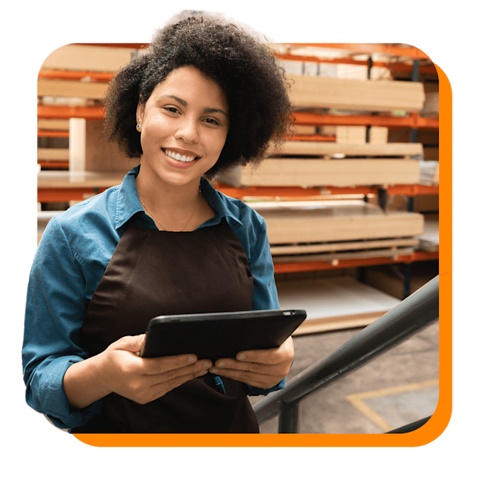 happy female worker with tablet at warehouse